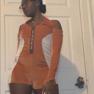 Orange and White jumper with brown on the front